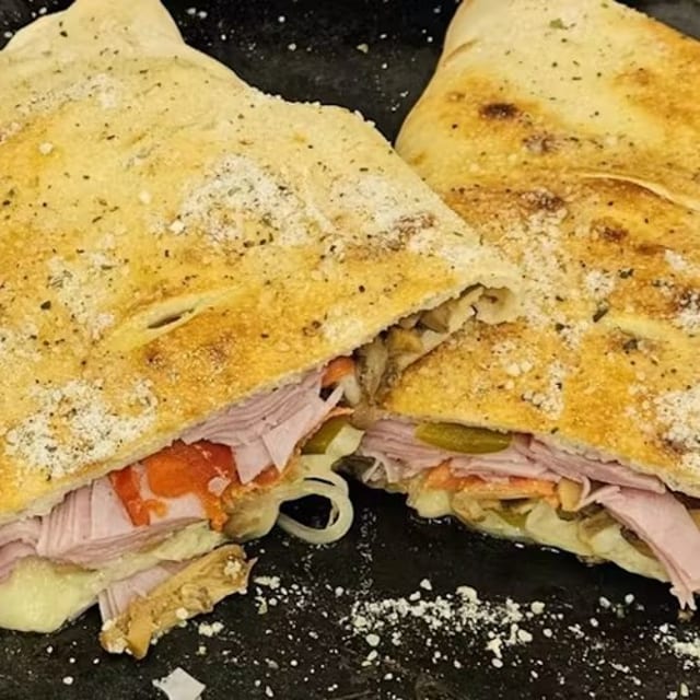 House Stromboli (Pepperoni, Salami, Ham. Mozzarella, Sweet Pepper, Mushrooms, and Onions).